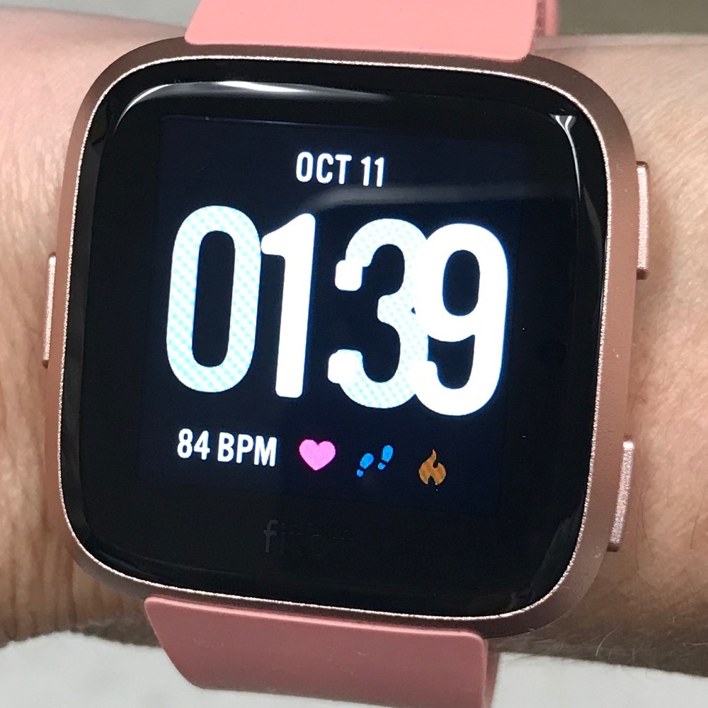 Fitbit versa peach/rose gold. Like new